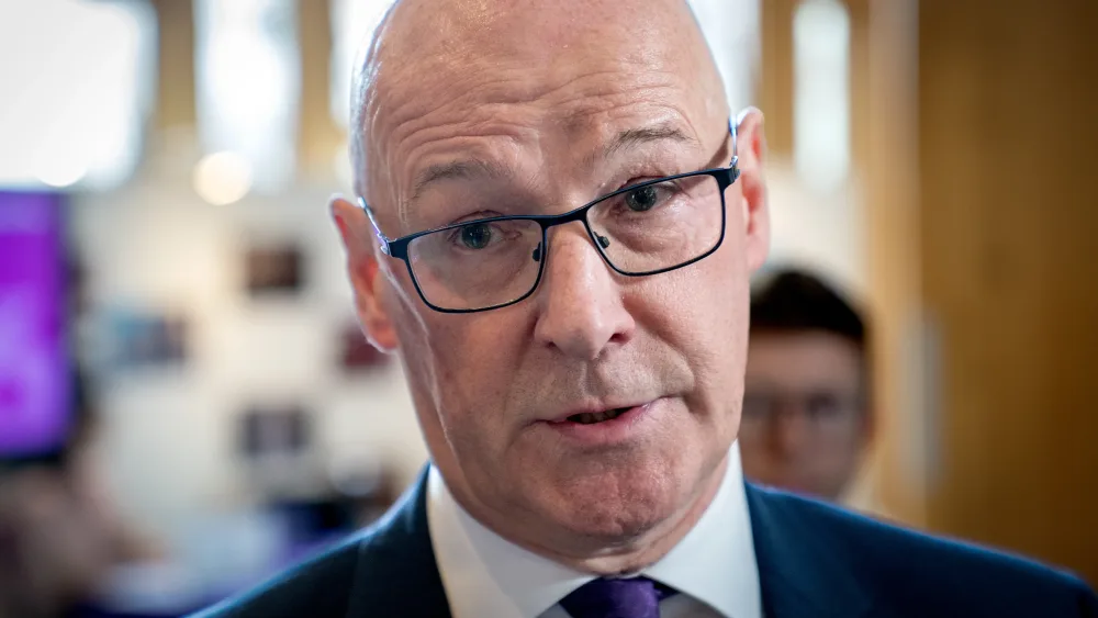 Headshot of John Swinney speaking