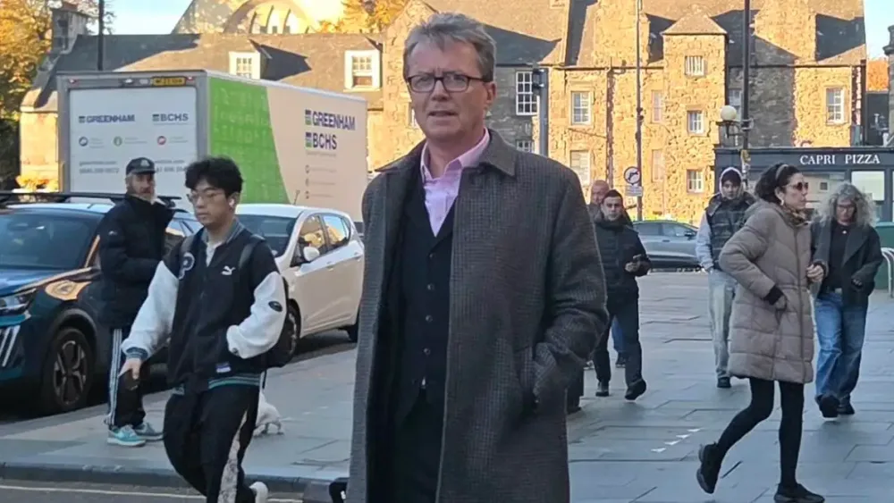 Nicky Campbell walking outside