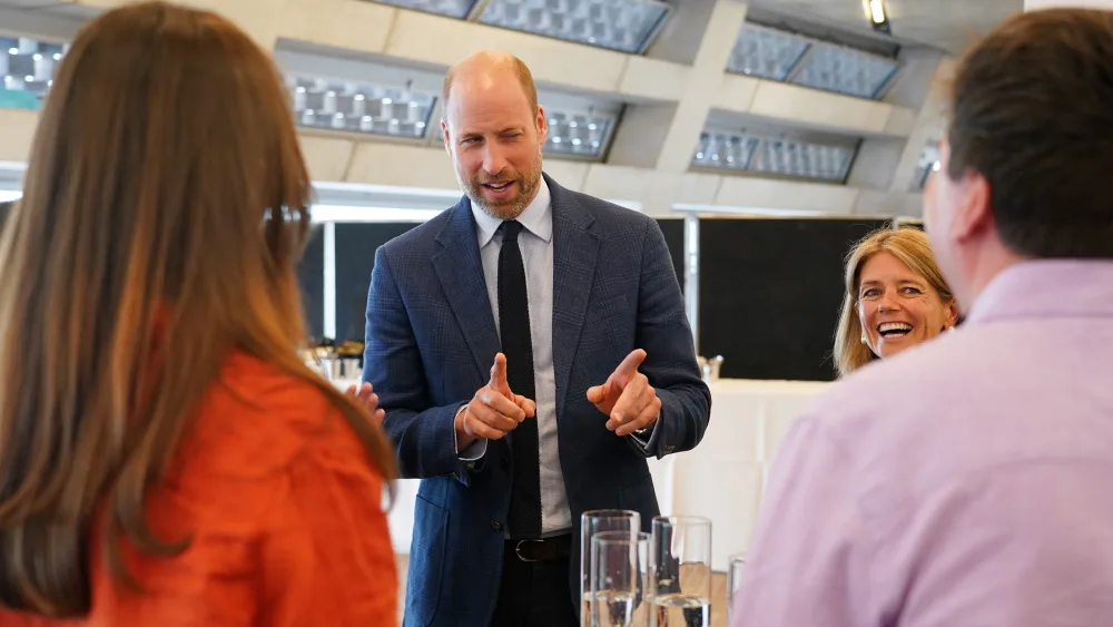 The Prince of Wales talks to participants at the Homewards event