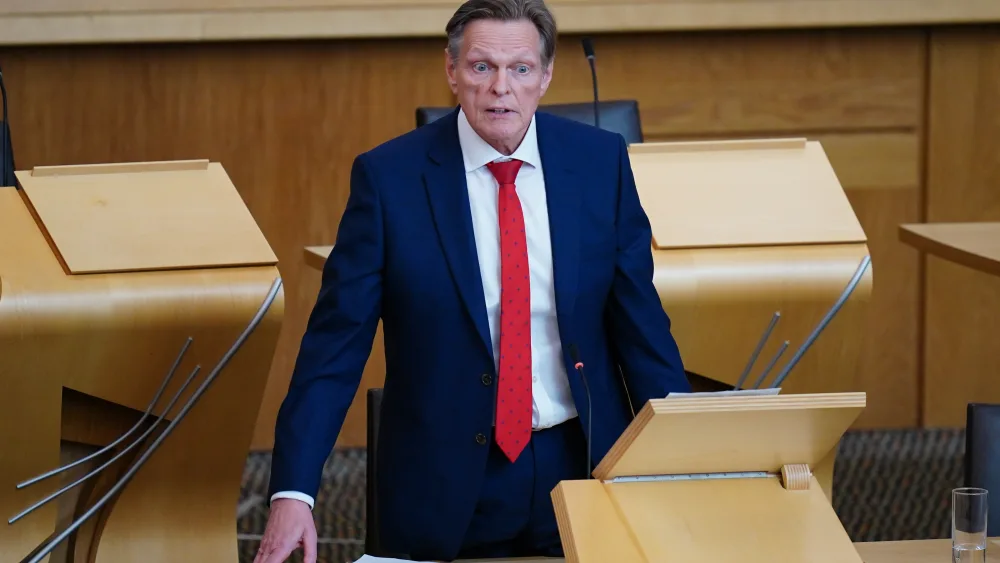 Stephen Kerr standing while speaking in Holyrood
