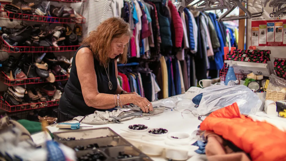 Barbara Myloff working in a charity shop